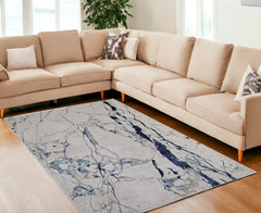 10' x 13' Ivory and Blue Marble Power Loom Distressed Area Rug