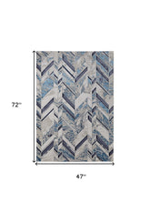 4' x 6' Ivory and Blue Chevron Power Loom Distressed Area Rug