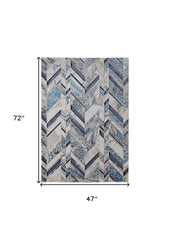 4' x 6' Ivory and Blue Chevron Power Loom Distressed Area Rug