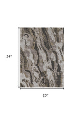 2' x 3' Brown and Ivory Abstract Power Loom Distressed Area Rug