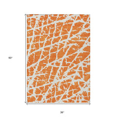 3' X 5' Orange and White Abstract Washable Non Skid Indoor Outdoor Area Rug