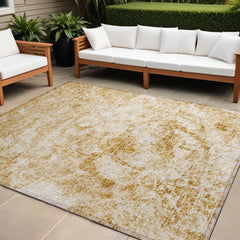 10' X 14' Cream and Gold Abstract Washable Non Skid Indoor Outdoor Area Rug