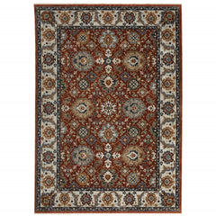 10' X 13' Red Blue Ivory Gold And Navy Oriental Power Loom Stain Resistant Area Rug With Fringe