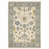10' X 13' Ivory Blue Grey Teal Gold Green And Rust Oriental Power Loom Stain Resistant Area Rug With Fringe