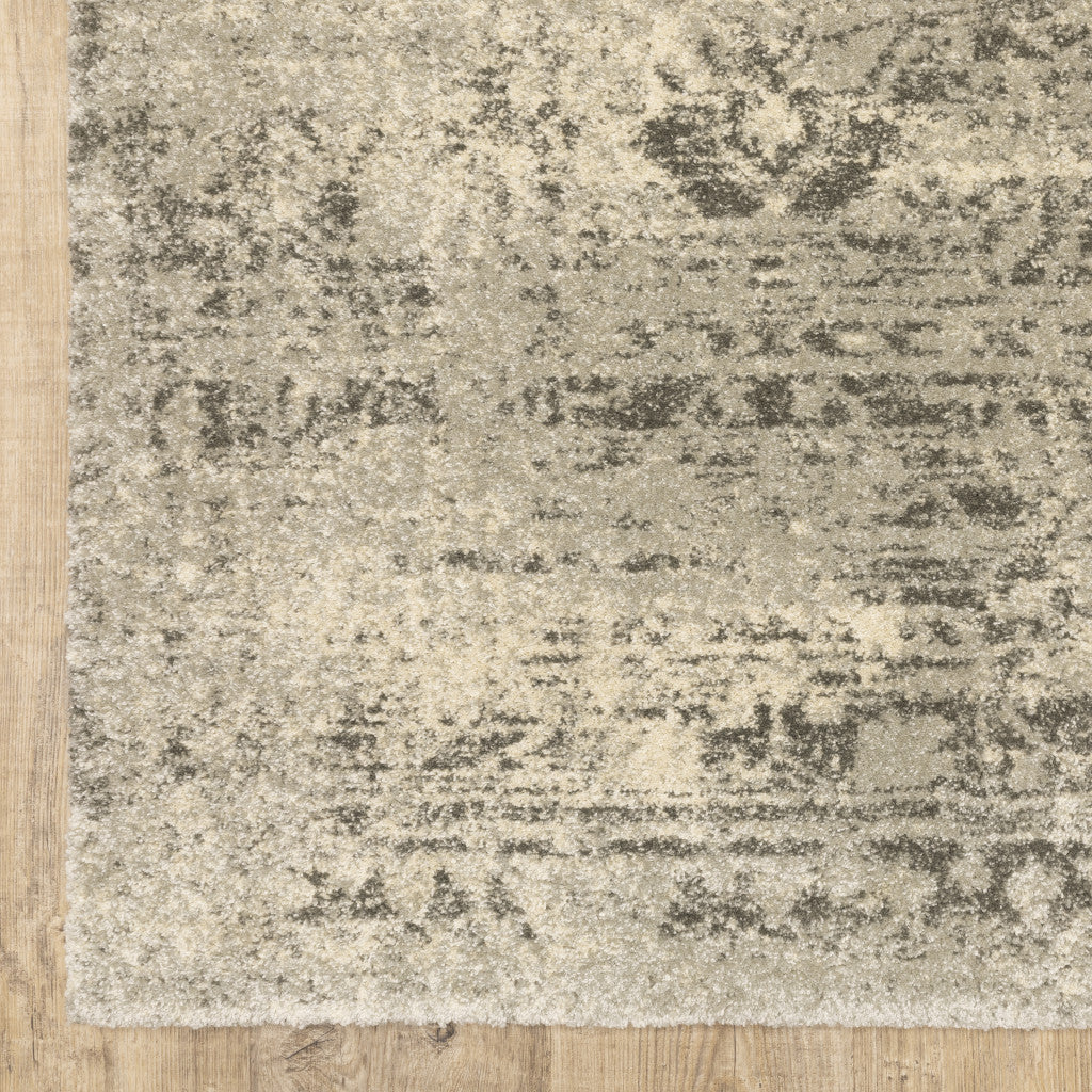 6' X 9' Grey Ivory Beige And Taupe Oriental Power Loom Stain Resistant Area Rug
