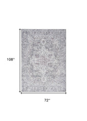 6' X 9' Blue And Pink Floral Power Loom Distressed Washable Area Rug