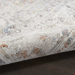 5' x 8' Ivory and Blue Oriental Power Loom Distressed Area Rug With Fringe