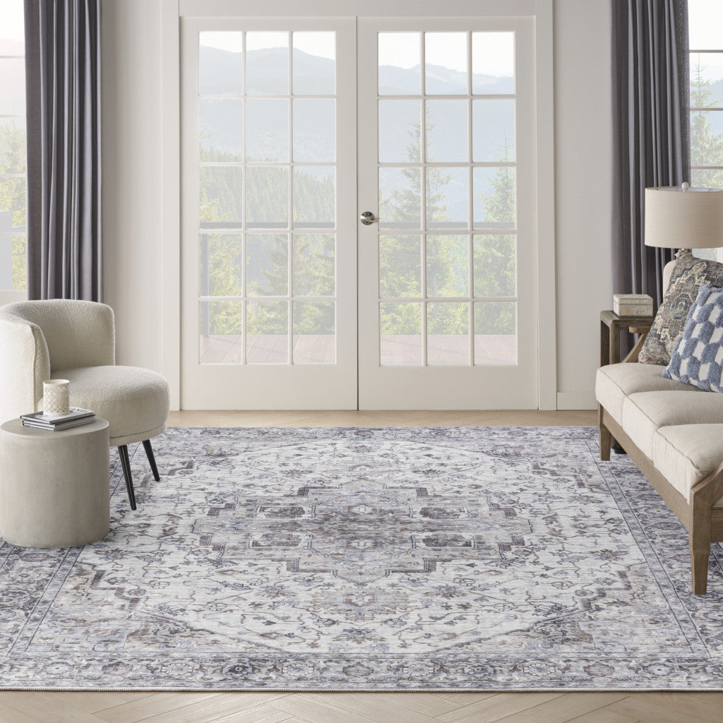 9' x 12' Beige and Ivory Floral Power Loom Distressed Washable Area Rug