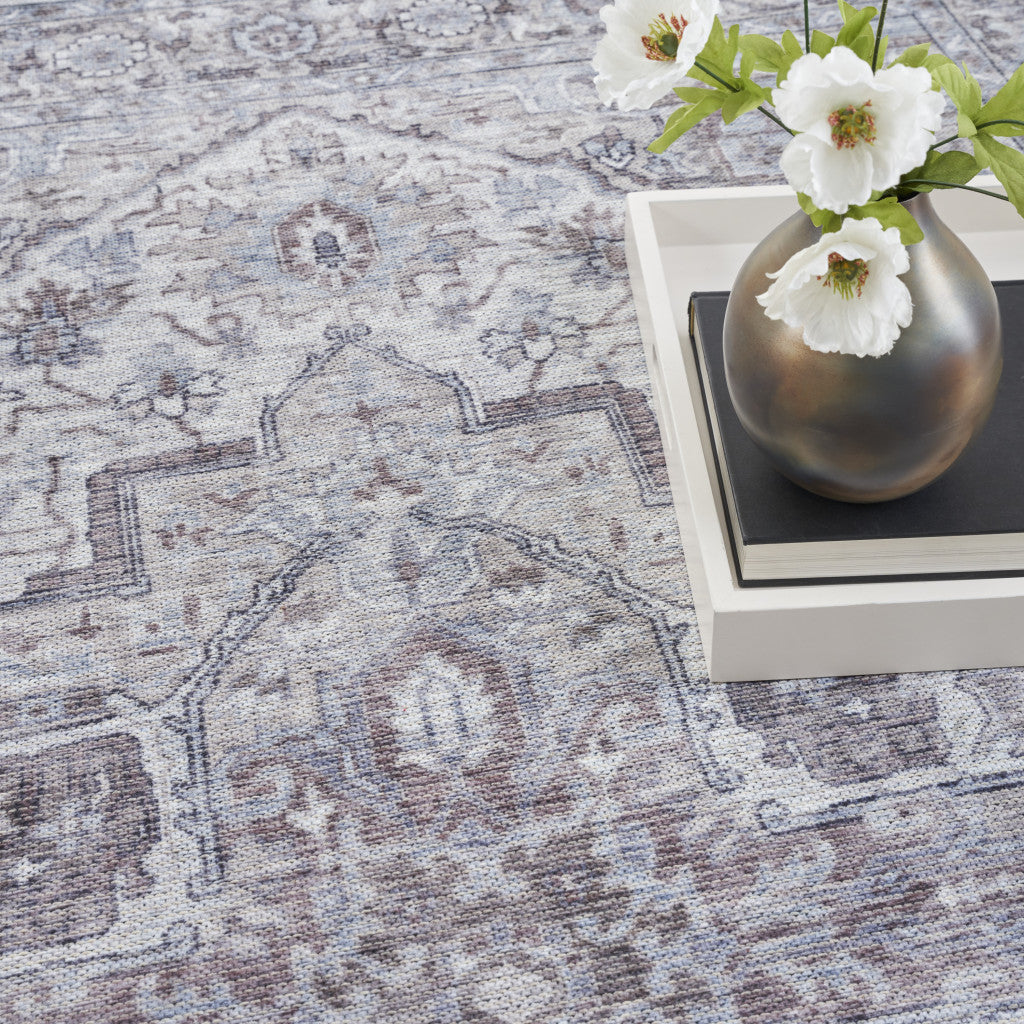9' x 12' Beige and Ivory Floral Power Loom Distressed Washable Area Rug