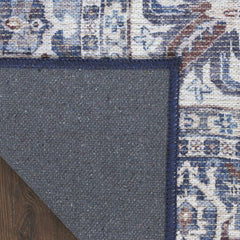9' x 12' Blue and Ivory Floral Power Loom Distressed Washable Area Rug