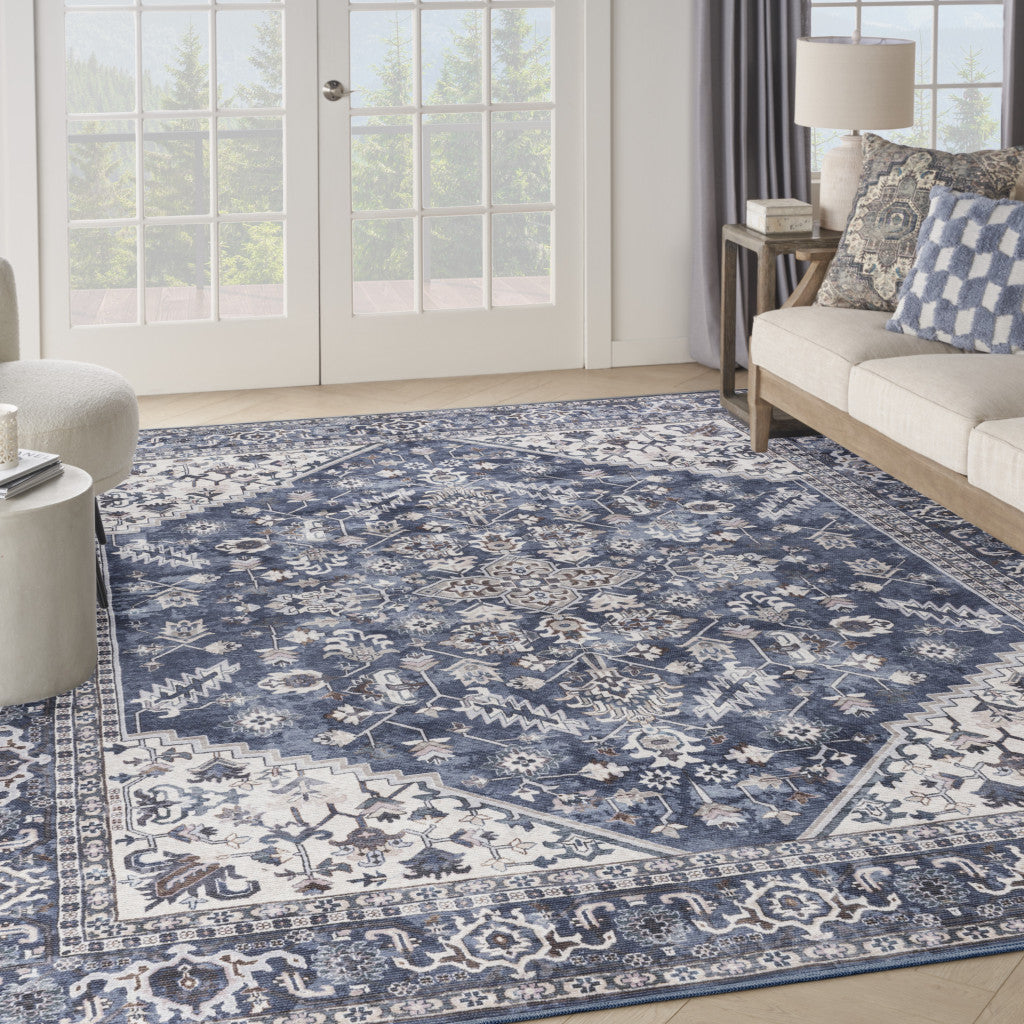 9' x 12' Blue and Ivory Floral Power Loom Distressed Washable Area Rug