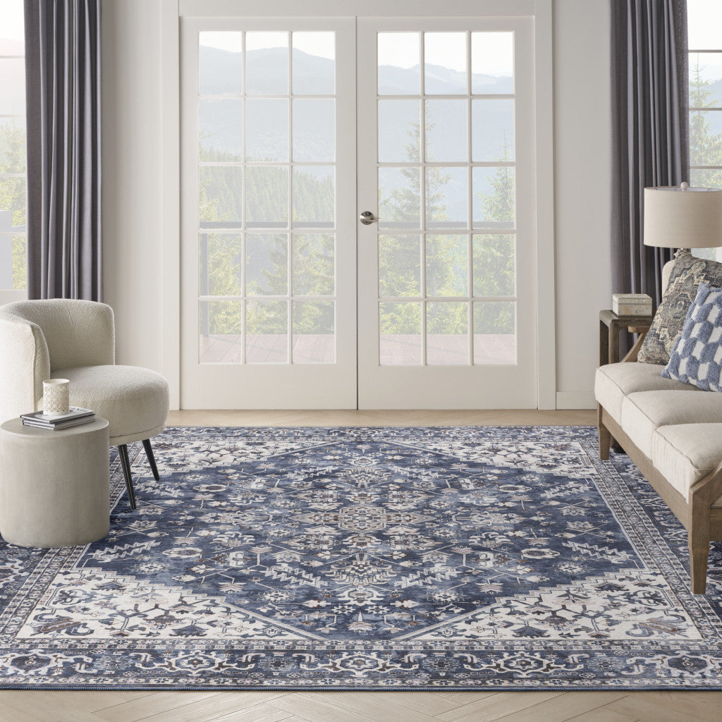 9' x 12' Blue and Ivory Floral Power Loom Distressed Washable Area Rug