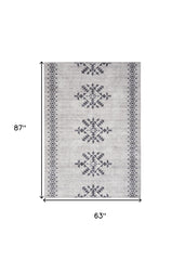 5' x 7' Gray and Ivory Geometric Power Loom Washable Area Rug