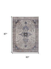 5' x 7' Ivory and Blue Oriental Power Loom Distressed Washable Non Skid Area Rug
