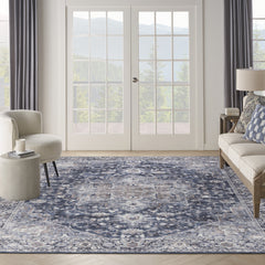 9' x 12' Blue and Ivory Floral Power Loom Distressed Washable Area Rug