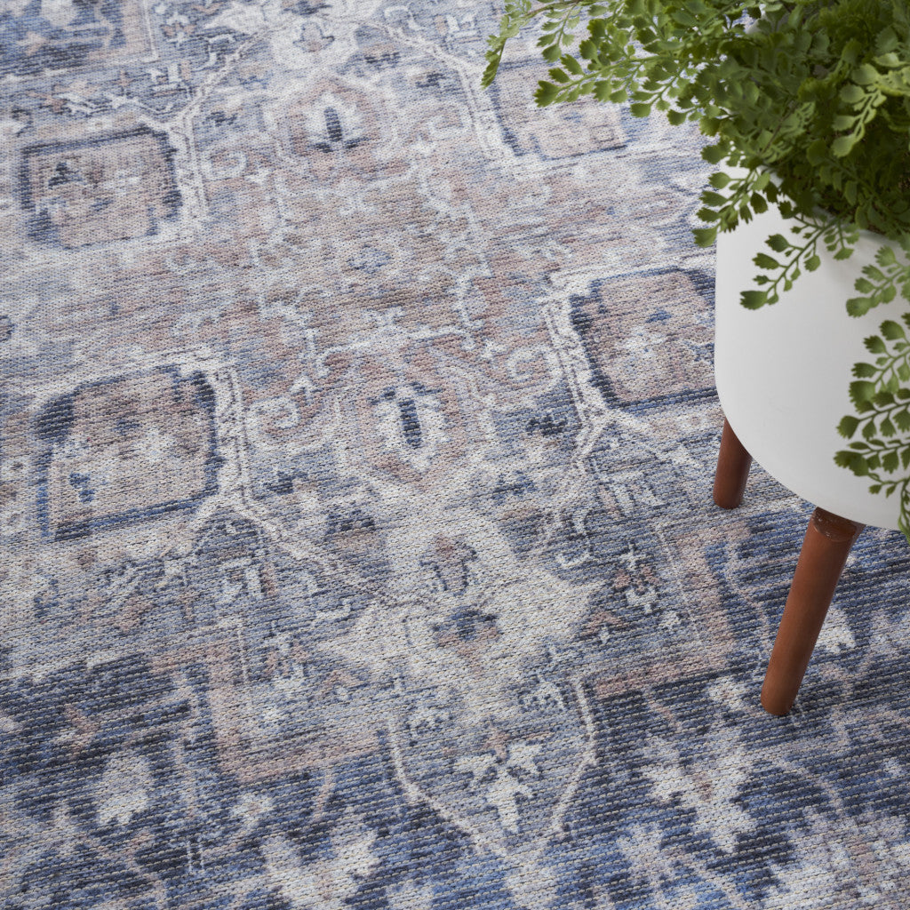 9' x 12' Blue and Ivory Floral Power Loom Distressed Washable Area Rug