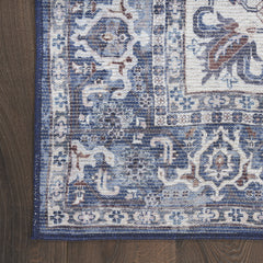 10' Blue and Ivory Floral Power Loom Distressed Washable Runner Rug