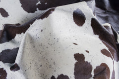 5' x 7' Brown and White Cowhide Hand Knotted Area Rug