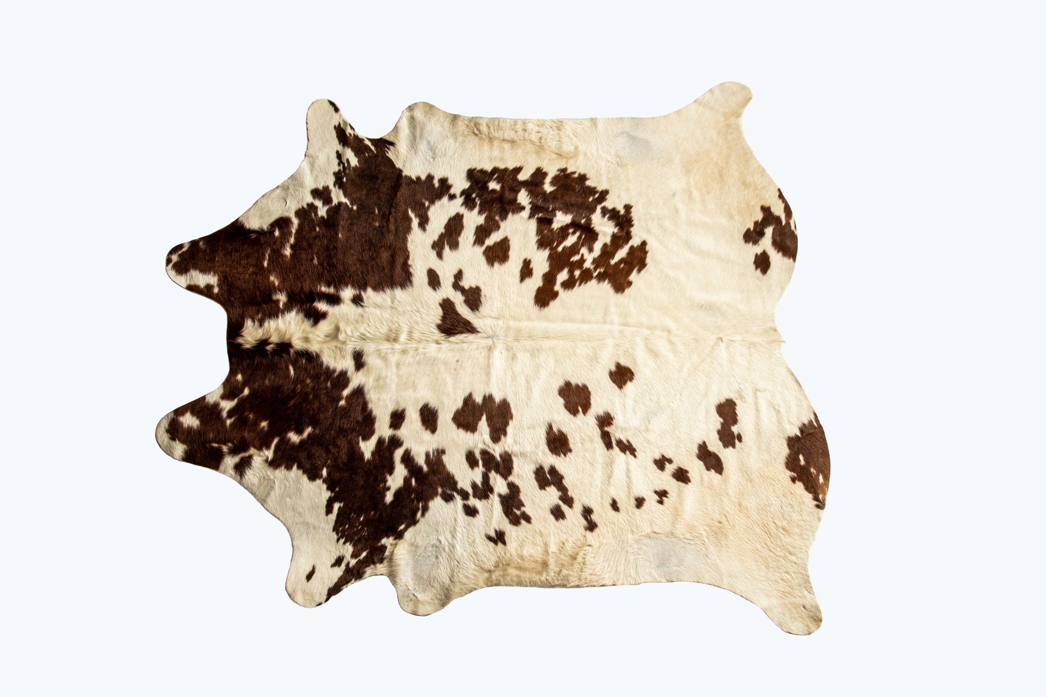 5' x 7' Brown and White Cowhide Hand Knotted Area Rug