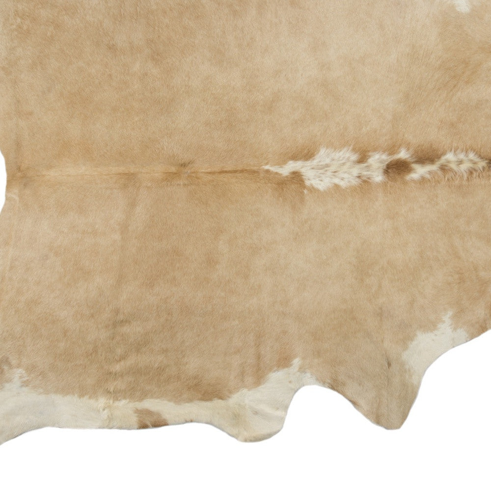 5' x 7' Brown and White Cowhide Hand Knotted Area Rug