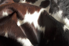 5' x 7' Brown and White Cowhide Hand Knotted Area Rug