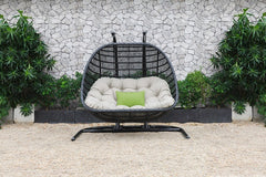 69" Beige And Black Metal Swing Chair With Beige Cushion