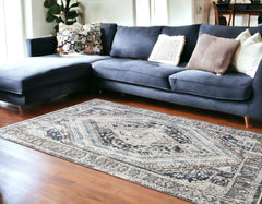 8' x 10' Gray Beige and Blue Geometric Distressed Area Rug With Fringe
