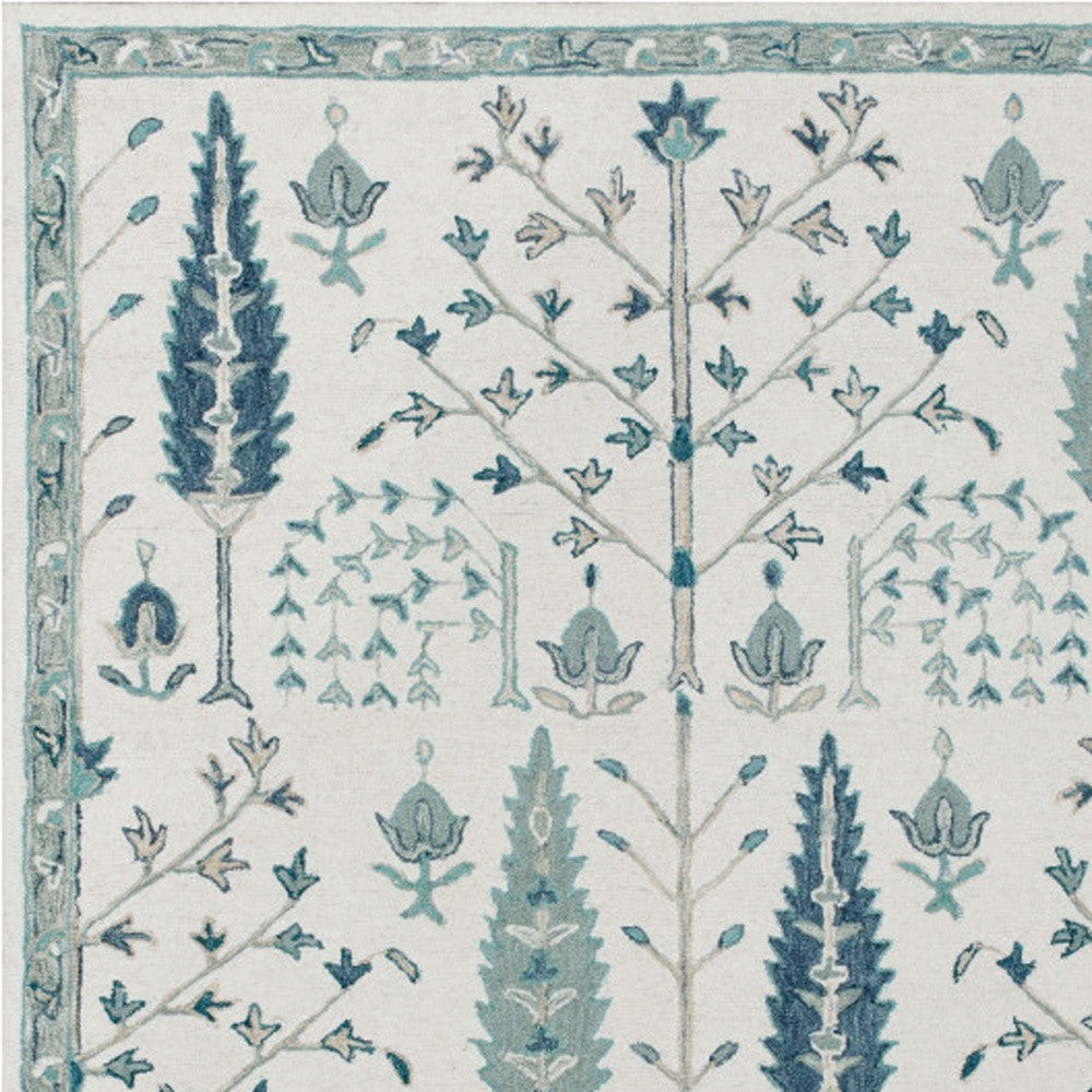 8' x 10' Ivory and Blue Wool Floral Hand Tufted Area Rug