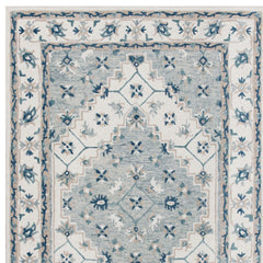 5' x 8' Blue and Ivory Wool Floral Hand Tufted Area Rug