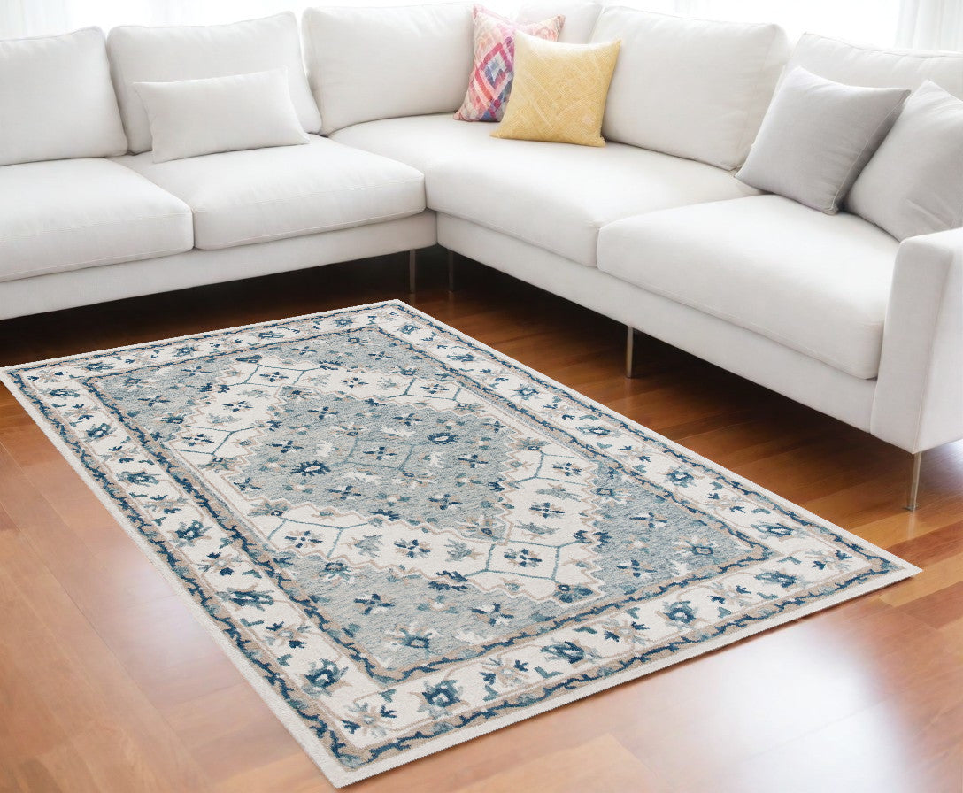 9' x 12' Blue and Ivory Wool Floral Hand Tufted Area Rug