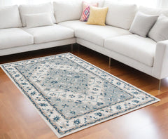 9' x 12' Blue and Ivory Wool Floral Hand Tufted Area Rug