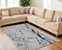 10' x 13' Ivory and Blue Marble Power Loom Distressed Area Rug