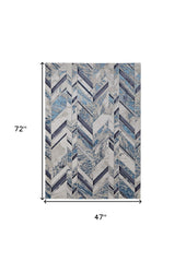 4' x 6' Ivory and Blue Chevron Power Loom Distressed Area Rug