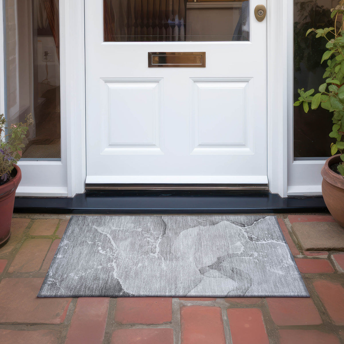 2' X 3' Gray and Ivory Abstract Washable Non Skid Indoor Outdoor Area Rug