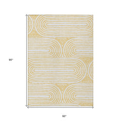 5' X 8' Gold and White Abstract Washable Non Skid Indoor Outdoor Area Rug