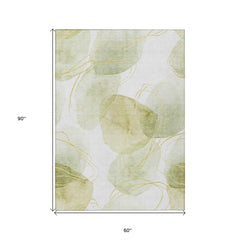 5' X 8' Green and Ivory Abstract Washable Non Skid Indoor Outdoor Area Rug