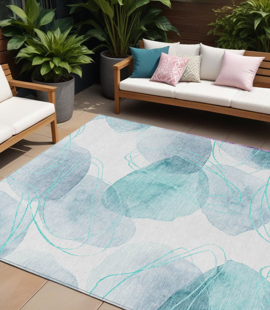 10' X 14' Teal and Ivory Abstract Washable Non Skid Indoor Outdoor Area Rug