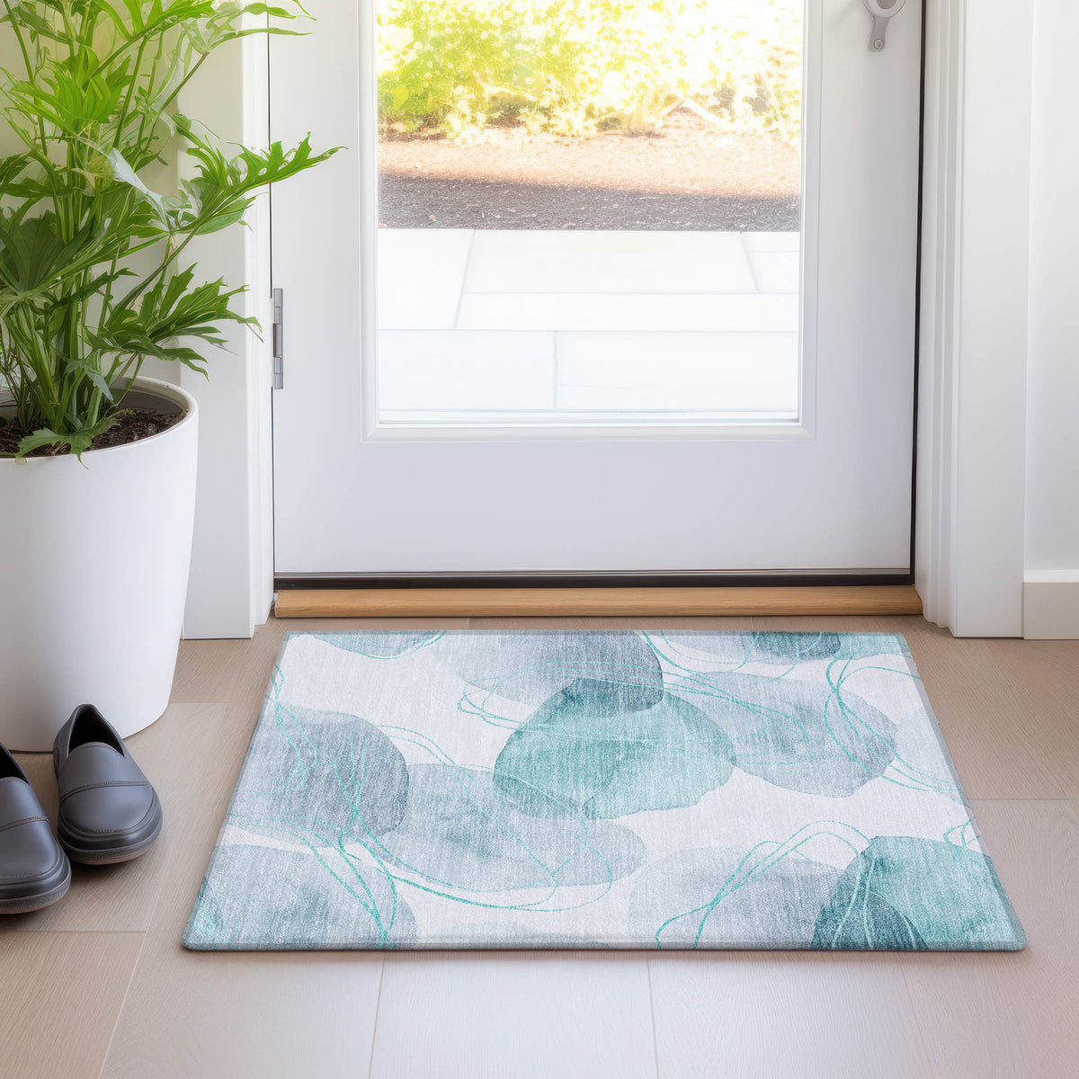 2' X 3' Teal and Ivory Abstract Washable Non Skid Indoor Outdoor Area Rug