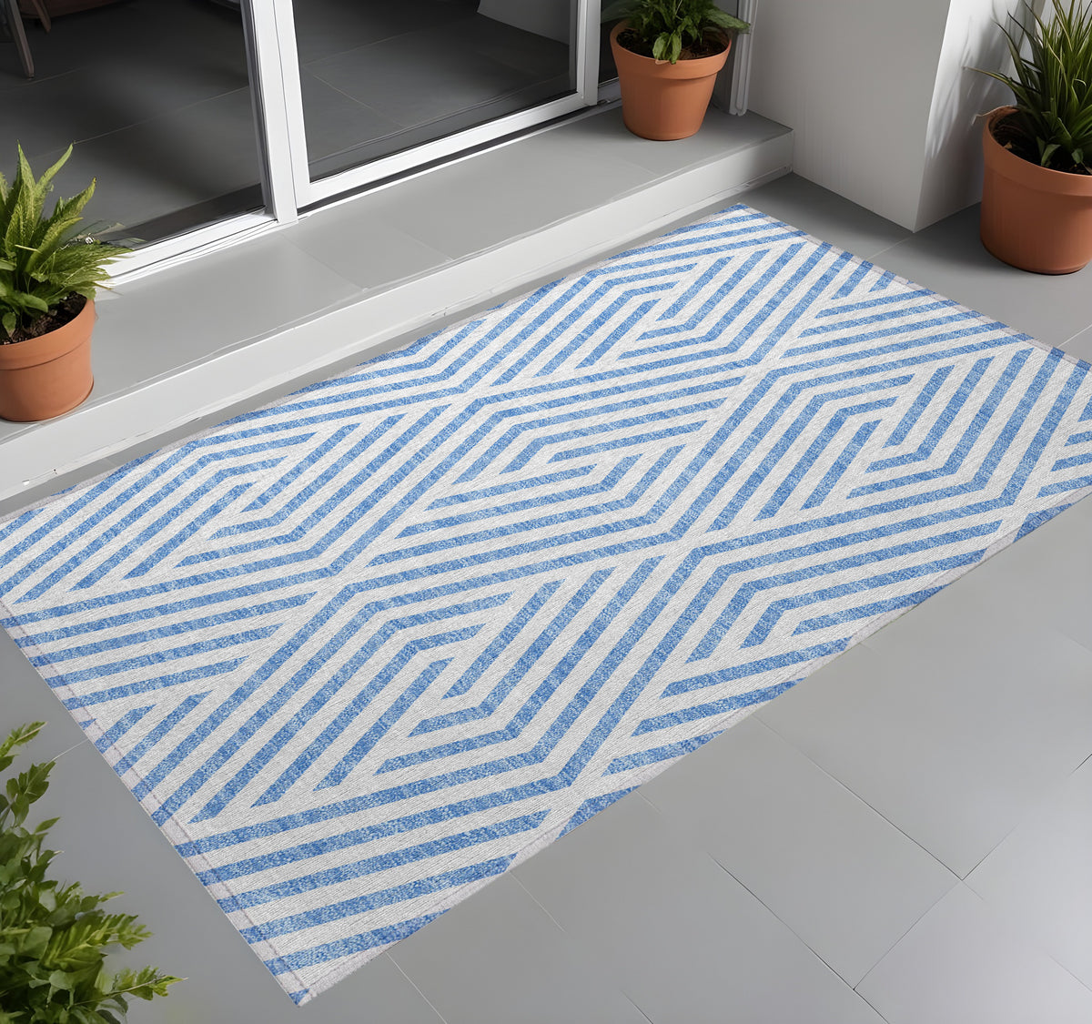 3' X 5' Blue and Ivory Geometric Washable Non Skid Indoor Outdoor Area Rug
