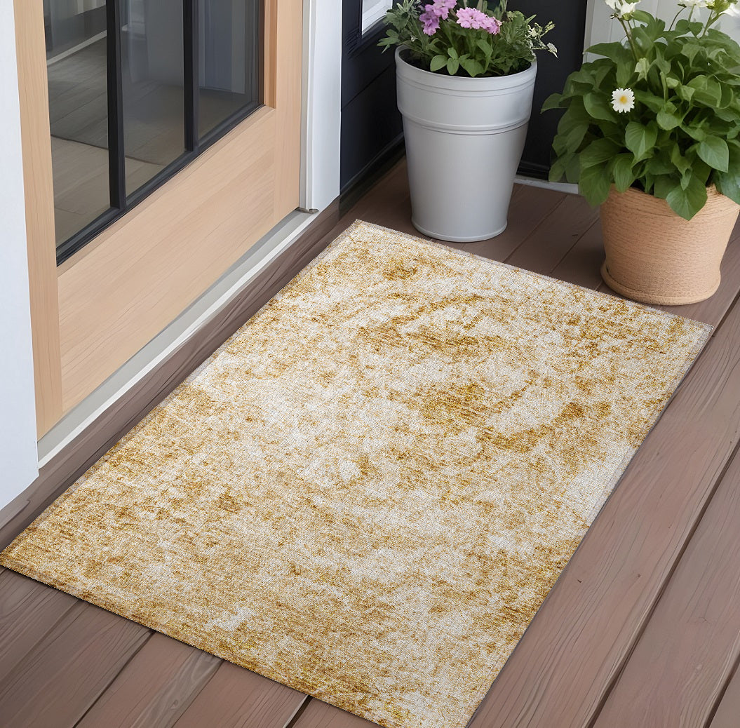 2' X 3' Cream and Gold Abstract Washable Non Skid Indoor Outdoor Area Rug
