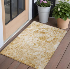 2' X 3' Cream and Gold Abstract Washable Non Skid Indoor Outdoor Area Rug
