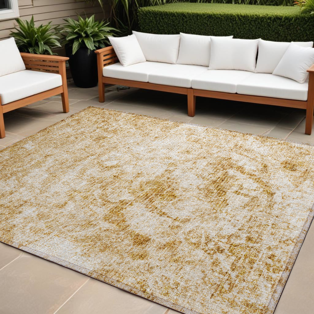 10' X 14' Cream and Gold Abstract Washable Non Skid Indoor Outdoor Area Rug