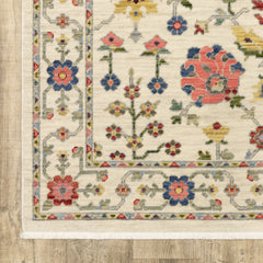 2' X 6' Ivory Salmon Pink Gold Blues Grey Rust And Green Oriental Power Loom Stain Resistant Runner Rug With Fringe